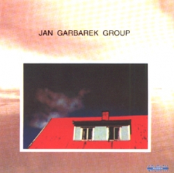 Jan Garbarek Group - Photo With Blue Sky, White Cloud, Wires, Windows And A Red Roof